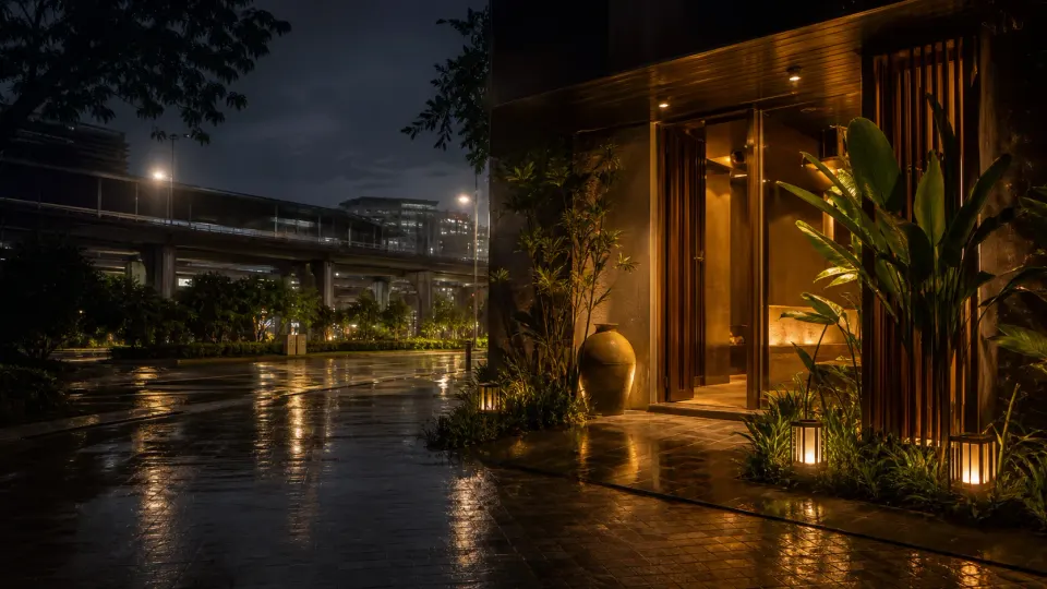 Rain-washed urban spa arrival scene near a transit corridor
