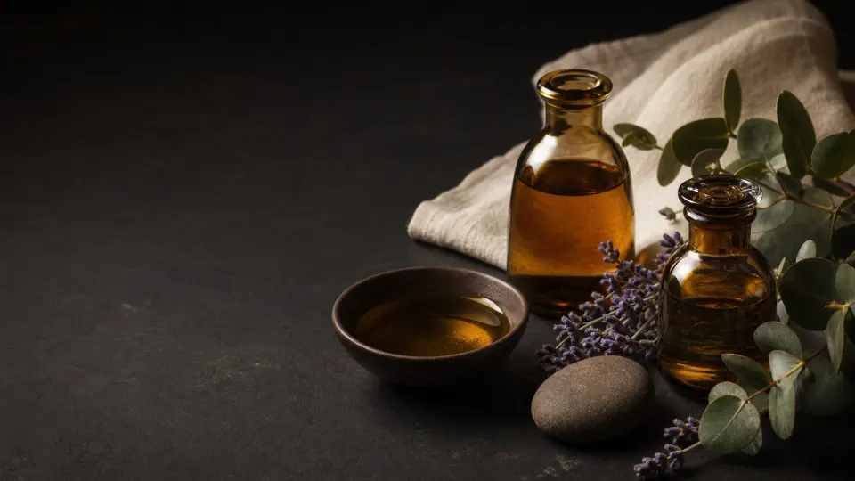 Amber massage oils, warm stone and aromatic botanicals