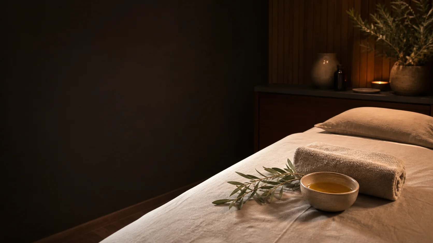 A warmly lit massage room prepared for a Heaven Local Spa guide