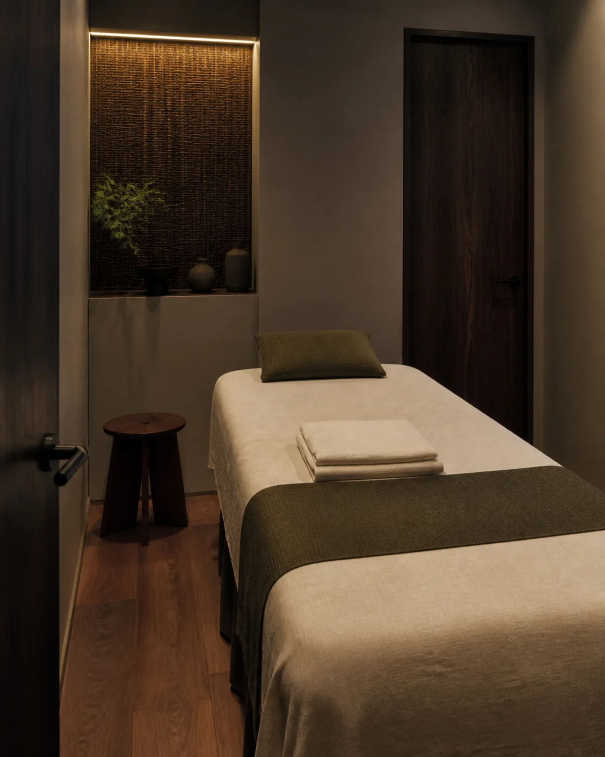 A private massage room with a prepared treatment table